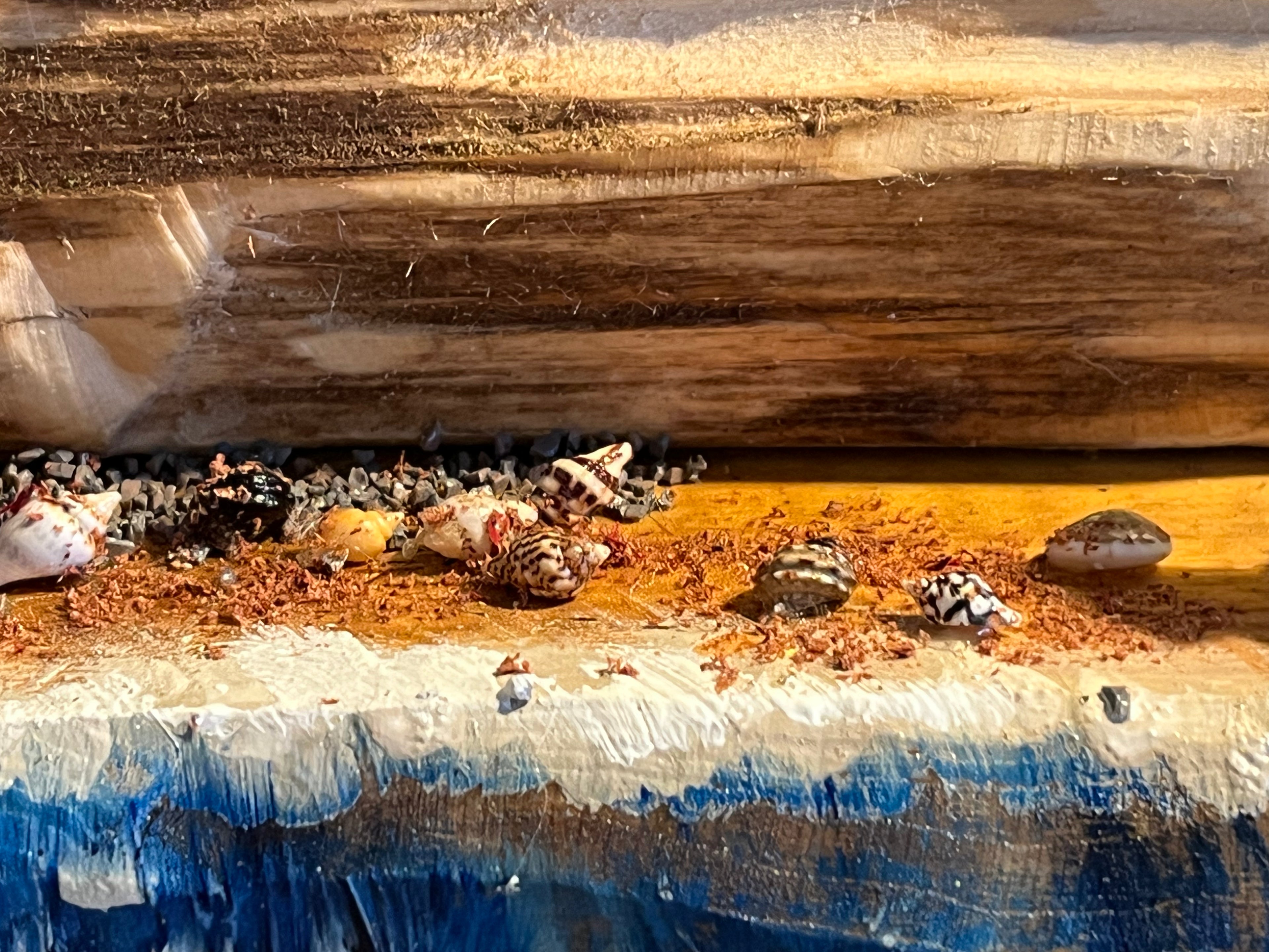 Close-up of a wooden surface with small stones and pebbles.